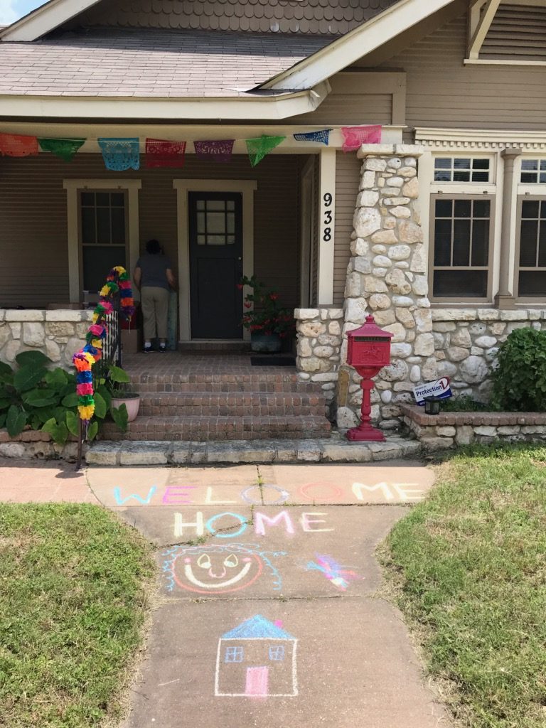 Welcome Home Chalk Drawing in Front of House